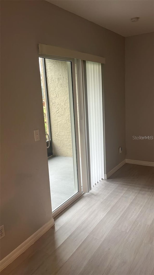 spare room with light hardwood / wood-style floors