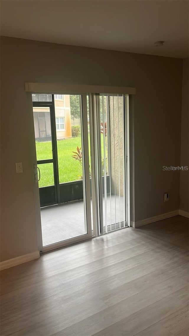 spare room featuring light wood-type flooring