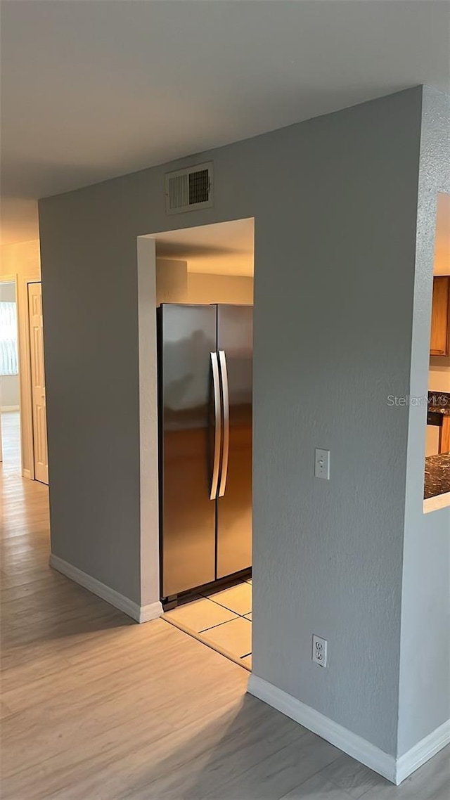 corridor featuring light hardwood / wood-style flooring