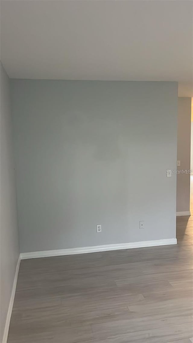 spare room featuring light hardwood / wood-style floors