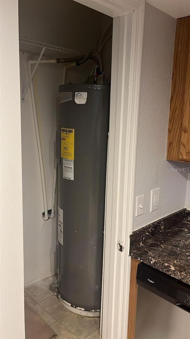 utility room with water heater