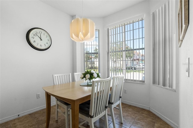 1256 S Beach Cir, Kissimmee, FL 34746 - dining space with baseboards and tile patterned flooring