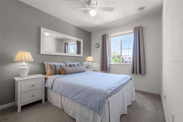 1256 S Beach Cir, Kissimmee, FL 34746 - bedroom with light carpet, baseboards, ceiling fan, and a textured ceiling