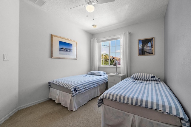 1256 S Beach Cir, Kissimmee, FL 34746 - carpeted bedroom with a ceiling fan, a textured ceiling, baseboards, and visible vents