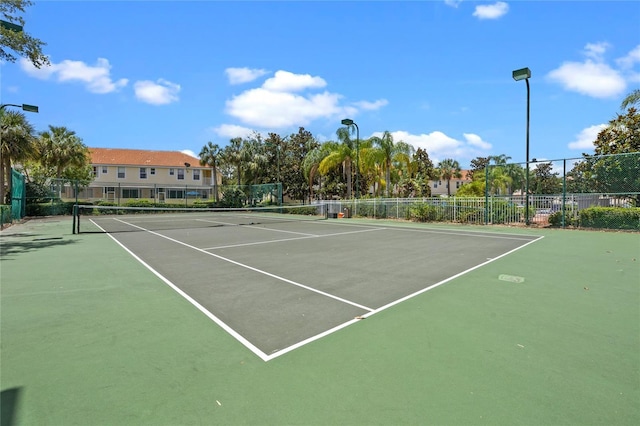 1256 S Beach Cir, Kissimmee, FL 34746 - view of tennis court featuring community basketball court and fence