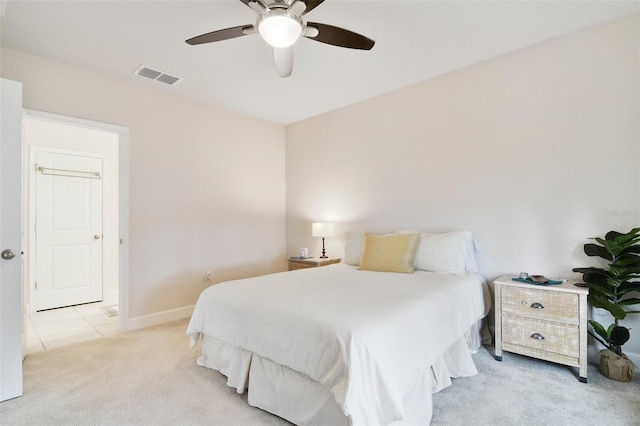 bedroom with light carpet and ceiling fan