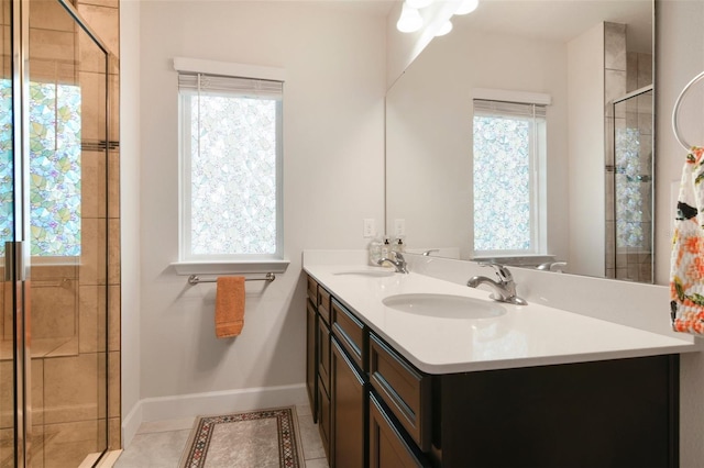 bathroom featuring tile patterned floors, walk in shower, and vanity