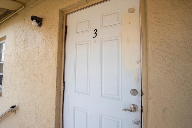 725 Michigan Ct Unit 3, Saint Cloud, FL 34769 - property entrance featuring stucco siding
