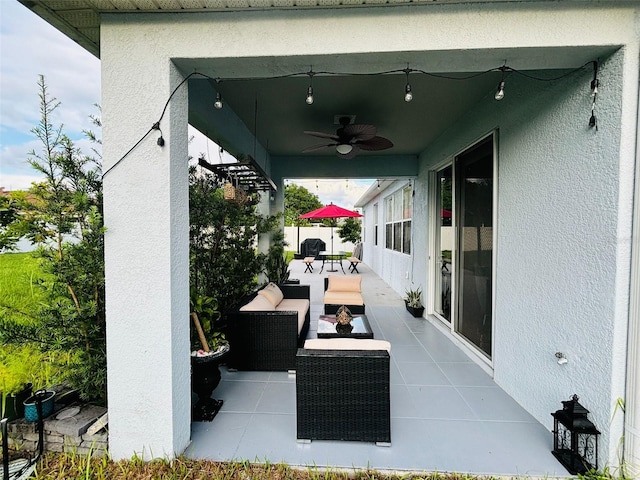 view of patio featuring ceiling fan and outdoor lounge area