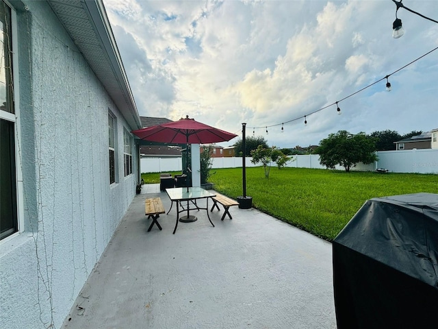 view of patio with a grill