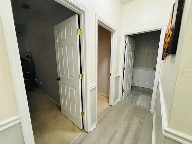 corridor featuring light hardwood / wood-style floors