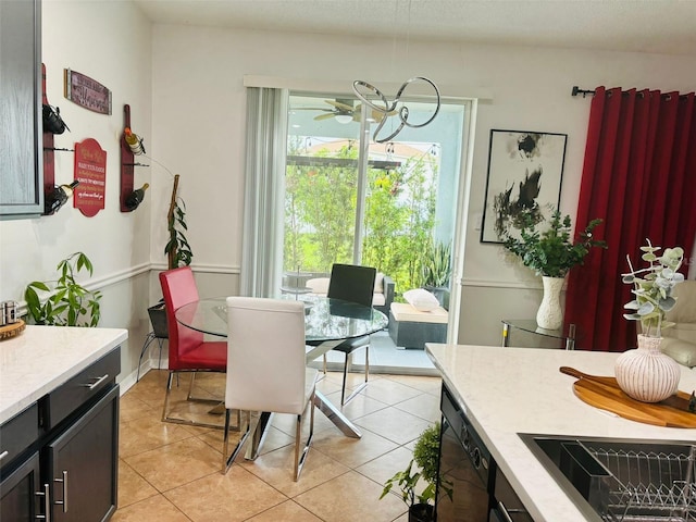 dining area featuring light tile patterned floors and ceiling fan