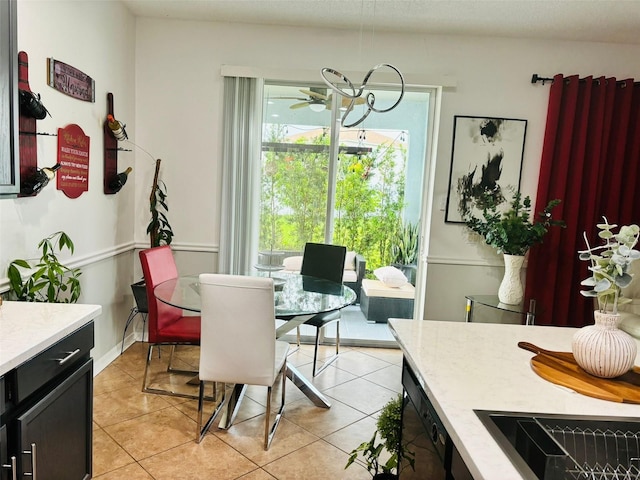 dining room with ceiling fan and light tile patterned flooring