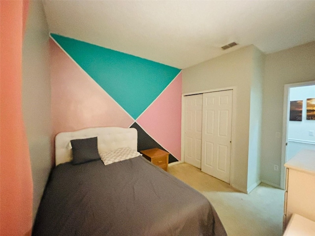 carpeted bedroom featuring a closet