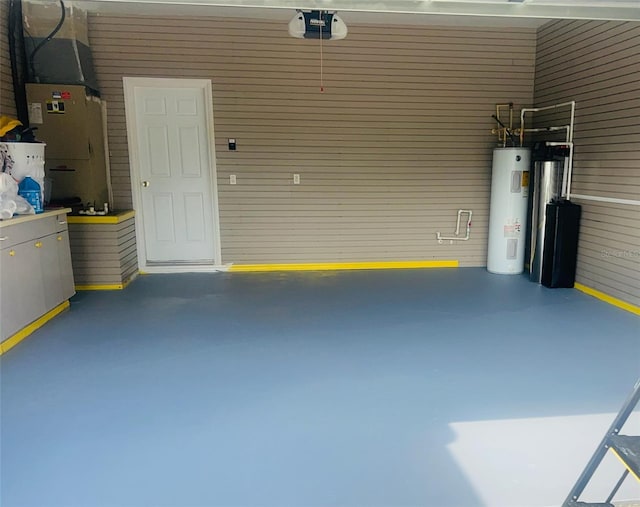 garage featuring water heater and a garage door opener