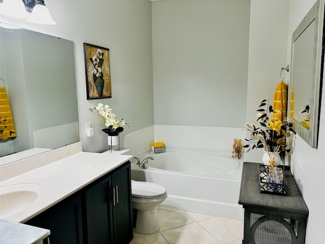 bathroom featuring vanity, tile patterned flooring, toilet, and a tub