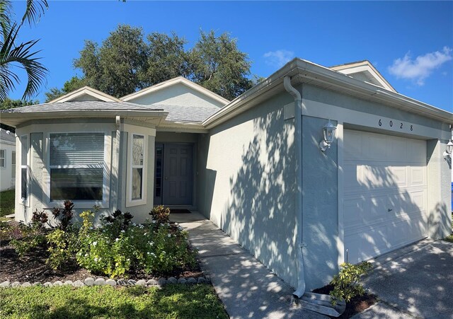 single story home with a garage