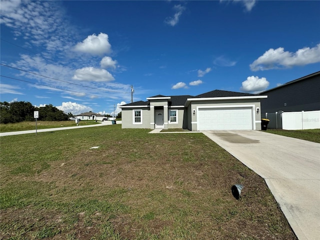 view of front of house with a garage and a front lawn