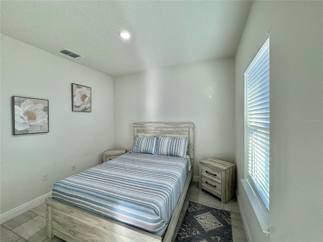 bedroom featuring a textured ceiling