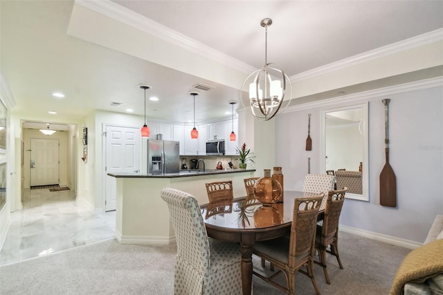 carpeted dining area featuring an inviting chandelier and ornamental molding