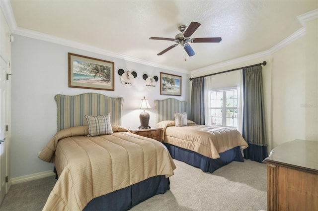 carpeted bedroom featuring ornamental molding and ceiling fan