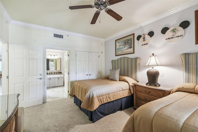 bedroom featuring light carpet, a closet, ceiling fan, and crown molding