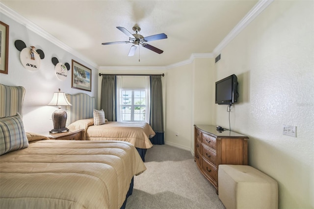 bedroom with crown molding, light carpet, and ceiling fan