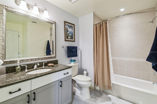 full bathroom featuring shower / bath combination with curtain, vanity, and toilet