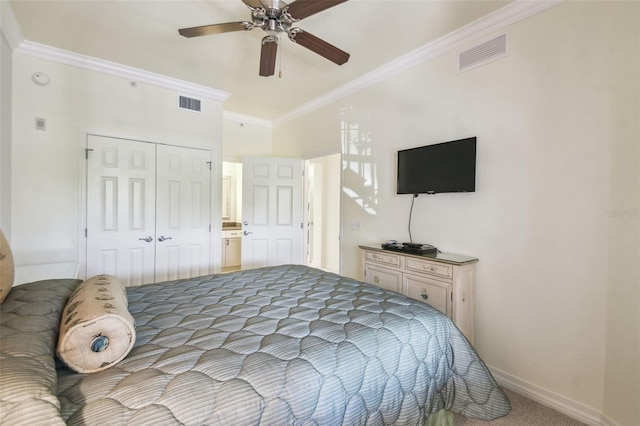 bedroom featuring light carpet, a closet, ceiling fan, and crown molding