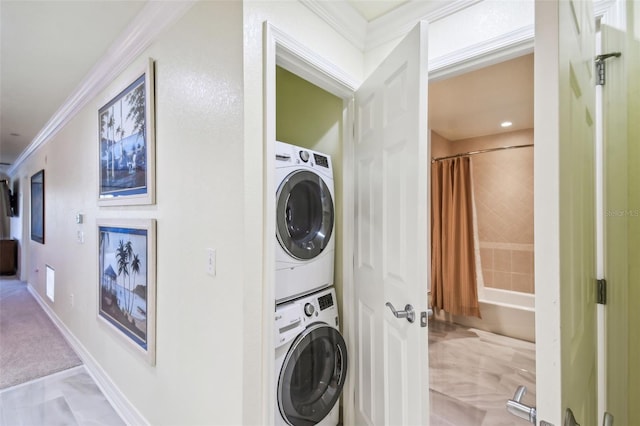 washroom featuring stacked washing maching and dryer, ornamental molding, and light tile patterned floors