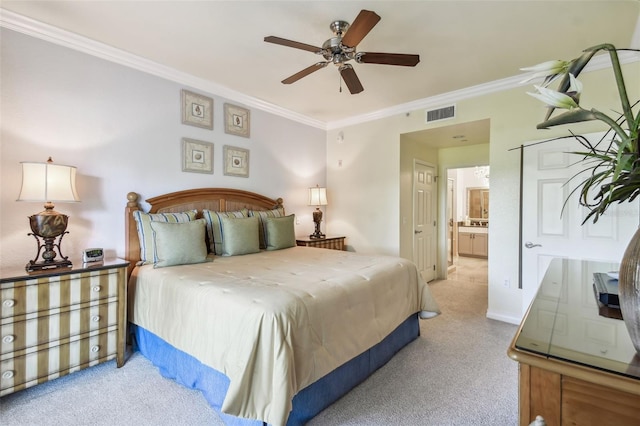 bedroom with ornamental molding, ceiling fan, ensuite bathroom, and light carpet