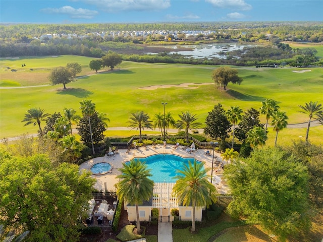 view of swimming pool with a patio and a water view