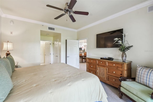 carpeted bedroom featuring ceiling fan and crown molding