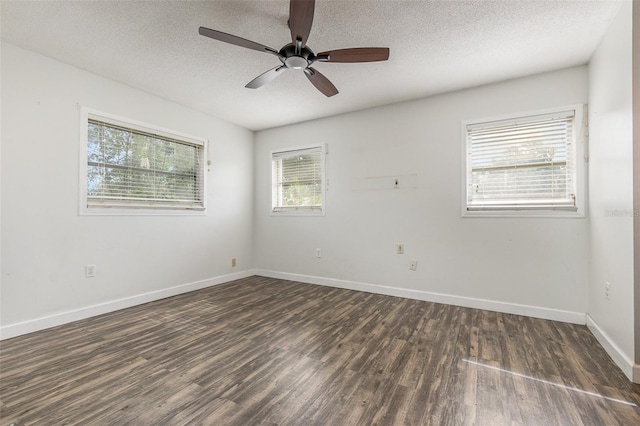 unfurnished room featuring ceiling fan, a textured ceiling, and dark wood-type flooring