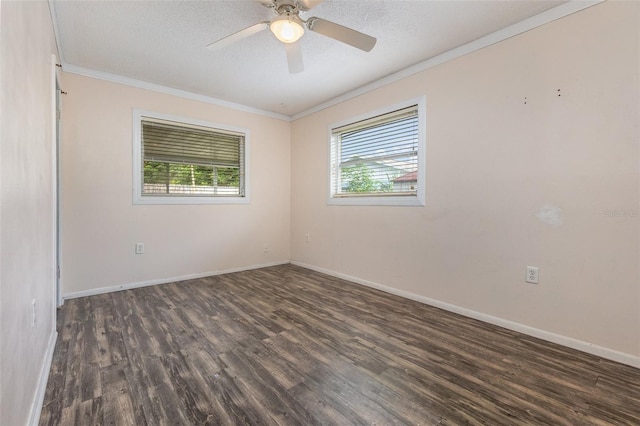 spare room with a textured ceiling, ornamental molding, dark hardwood / wood-style floors, and ceiling fan