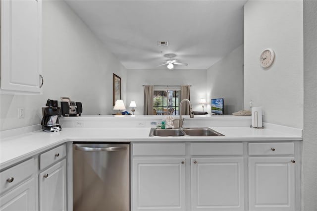 kitchen featuring ceiling fan, kitchen peninsula, sink, stainless steel dishwasher, and white cabinetry