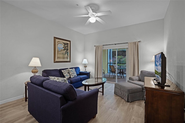 living room with ceiling fan and light wood-type flooring