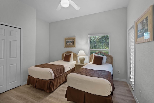 bedroom featuring a closet, light wood-type flooring, and ceiling fan