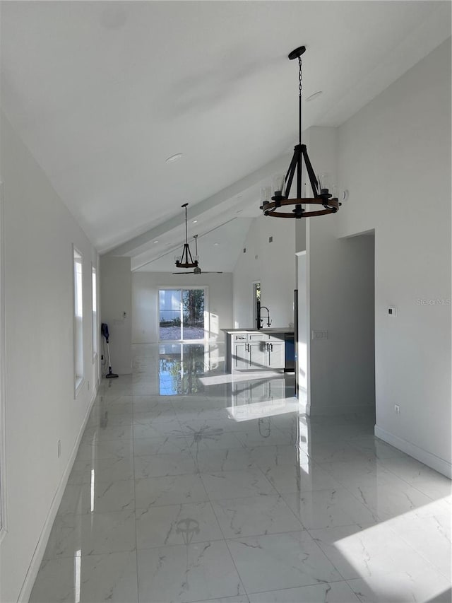 interior space with high vaulted ceiling and beam ceiling