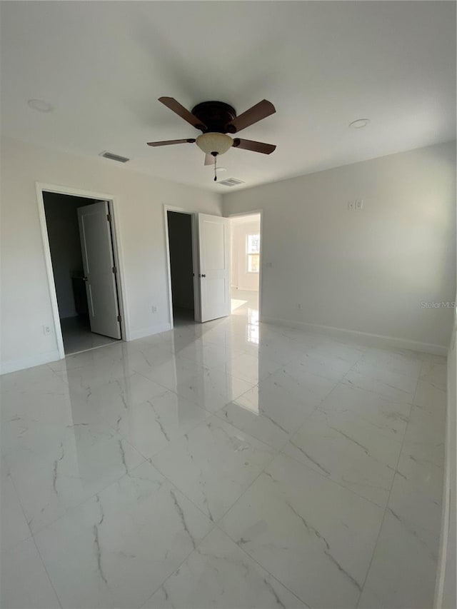 spare room featuring ceiling fan