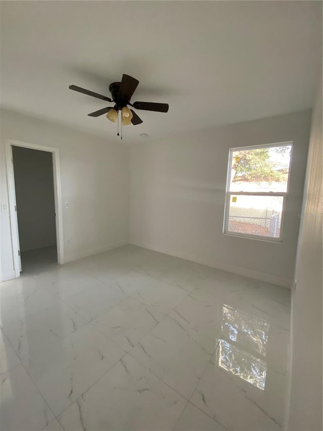 spare room with ceiling fan