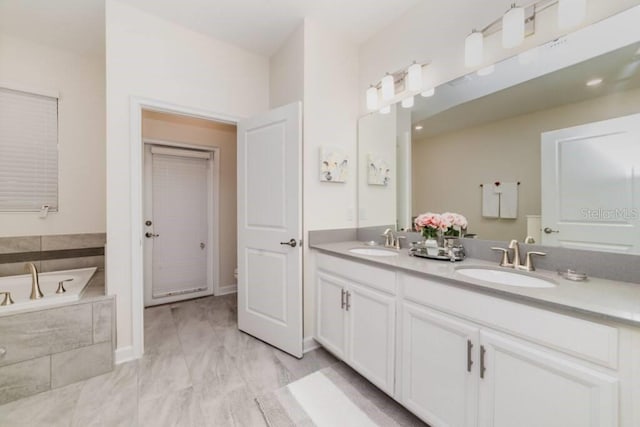 1676 Moon Valley Dr, Davenport, FL 33896 - full bath featuring a sink, double vanity, and a garden tub