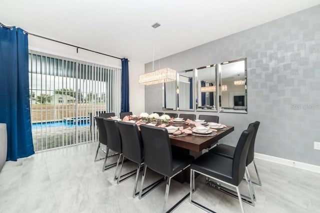 dining room featuring baseboards