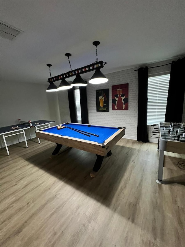 rec room featuring visible vents, billiards, wood finished floors, and brick wall