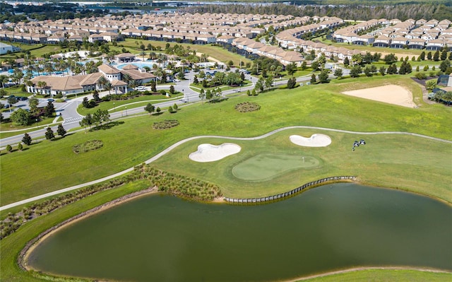 bird's eye view with a residential view, golf course view, and a water view