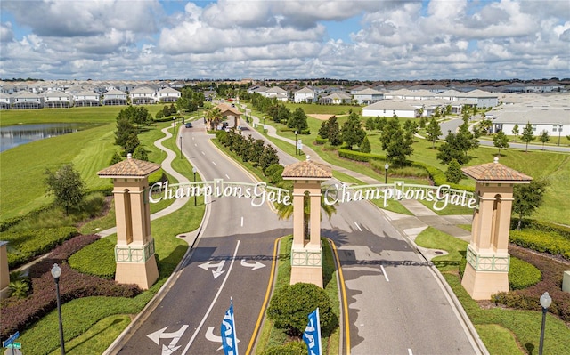 bird's eye view with a residential view and a water view