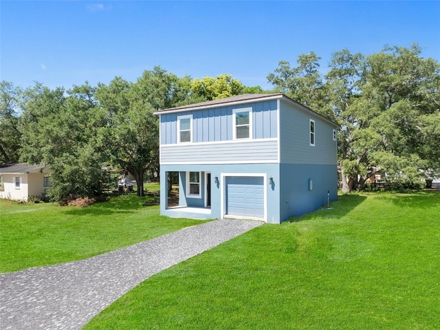 view of front facade featuring a front yard and a garage