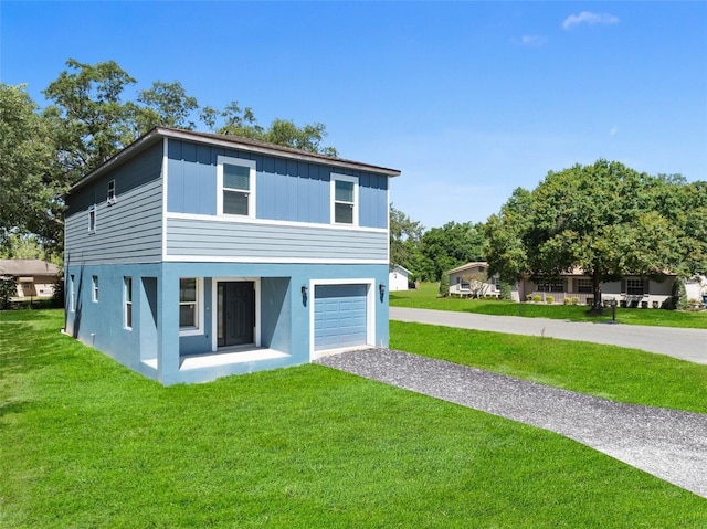 view of front of property with a garage and a front yard