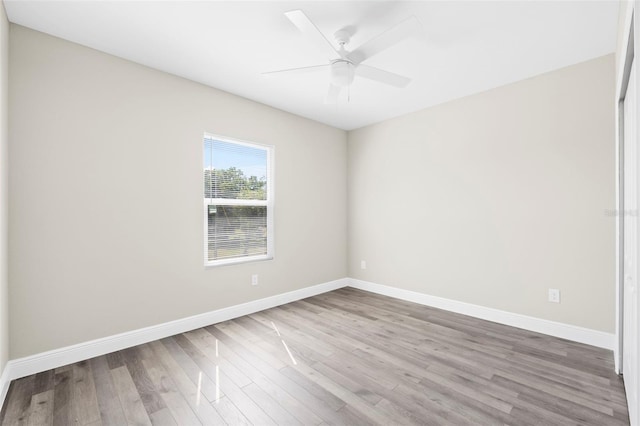 empty room featuring wood-type flooring and ceiling fan