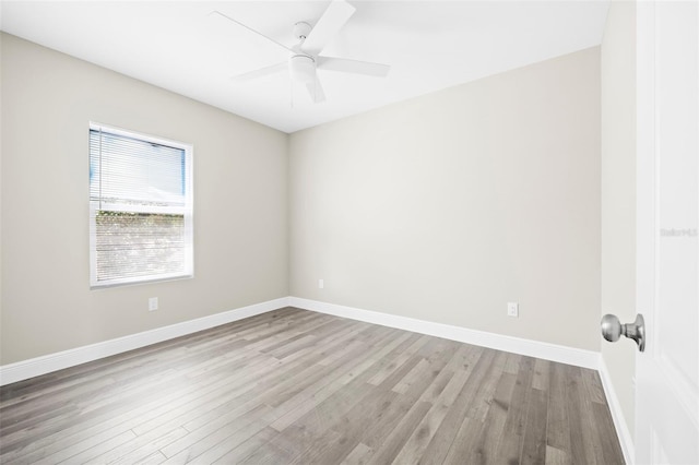 unfurnished room featuring light wood-type flooring and ceiling fan